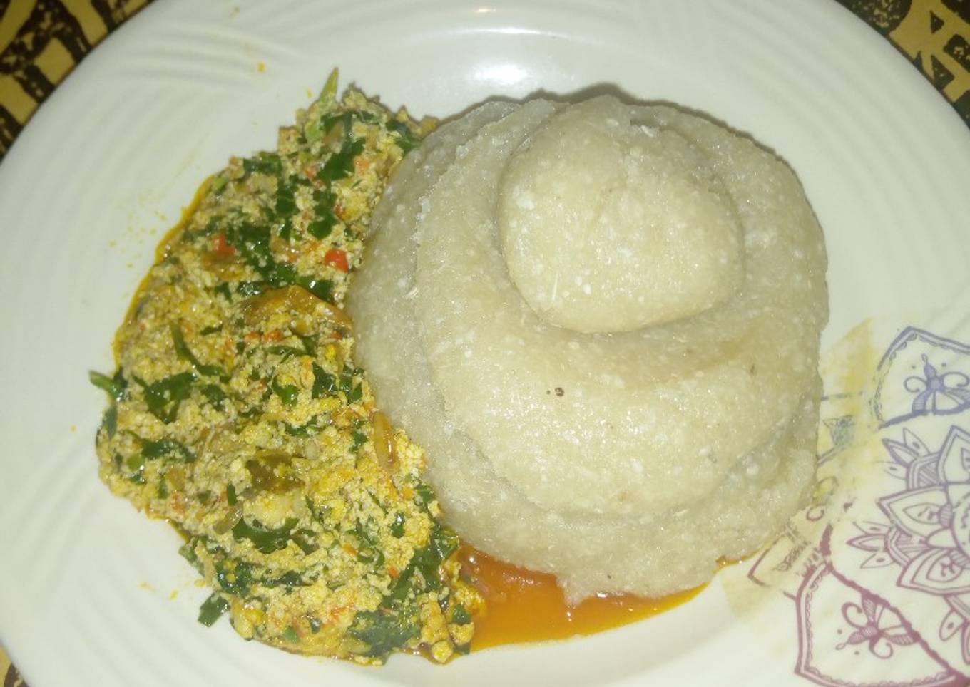 Eba and Egusi stew with minced Fish