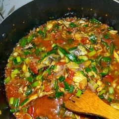 A picture of Fish and tomatoes sauce.