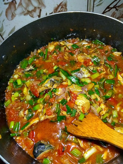A picture of Fish and tomatoes sauce.