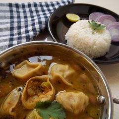 A picture of Potato Stuffed Dal Dhokli Recipe Mashed Potato Dumplings With Lentil Curry.