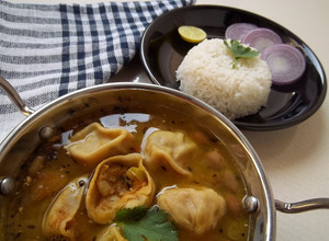 A picture of Potato Stuffed Dal Dhokli Recipe Mashed Potato Dumplings With Lentil Curry.