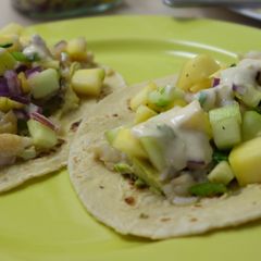 A picture of Fish tacos with mango salsa and yoghurt-lime sauce.