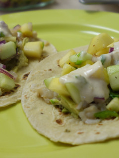 A picture of Fish tacos with mango salsa and yoghurt-lime sauce.