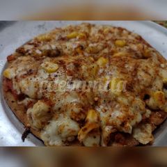 A picture of Whole wheat thin crust cheese corn pizza.
