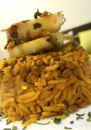 A picture of Masoor Pulao topped with Boiled Egg Slices.