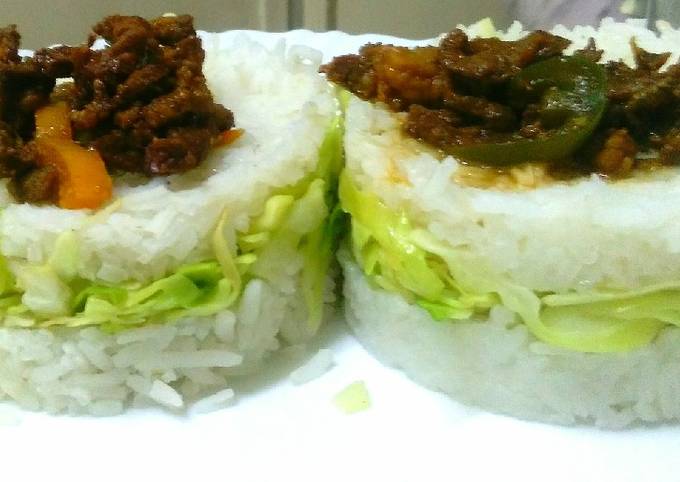 Goat meat strips in cabbage rice sandwich