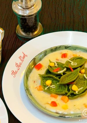 A picture of Olive leaves pasta in white sauce.
