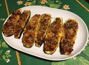 Une photo de Courgettes farcies jambon tomates emmental et origan