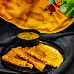 A picture of Tomato chutney dosa.
