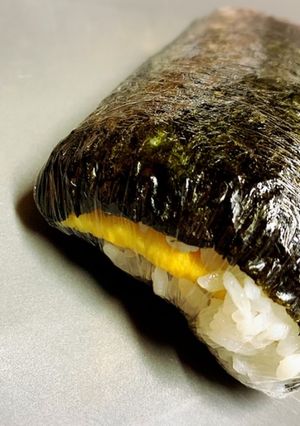 A picture of Sweet and Savory Pork and Egg Onigiri.