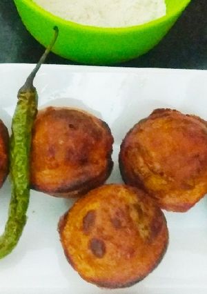A picture of Kuttu atta ke Alu Vade in appe maker.
