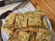 A picture of garlic bread in oven