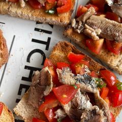 A picture of Amalfi Bruschetta with Sardines, Piccolo Tomatoes & Basil.