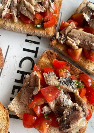 A picture of Amalfi Bruschetta with Sardines, Piccolo Tomatoes & Basil.