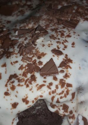 A picture of Chocolate cake with whipped cream.