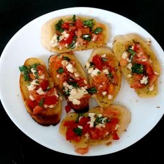 A picture of My Garlic bread Brushetta Snack 💛.