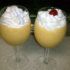 A picture of fresh mango and banana smoothie.