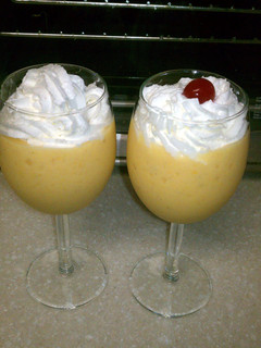 A picture of fresh mango and banana smoothie.