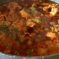 A picture of Chicken in brown onion paste.