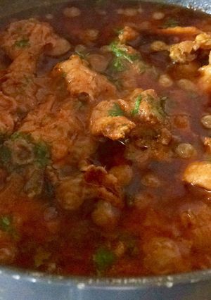 A picture of Chicken in brown onion paste.