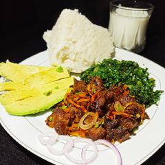A picture of Fried Red meat with greens.