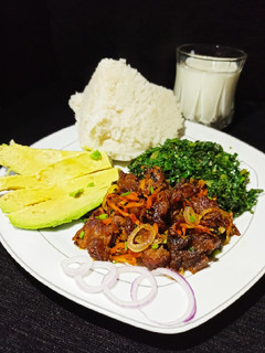 A picture of Fried Red meat with greens.