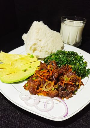 A picture of Fried Red meat with greens.