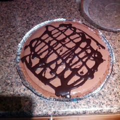 A picture of Chocolate Turtle Cheese Cake.