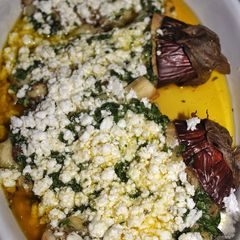 A picture of Aubergine with Olive Oil, Garlic, Parsley and Feta Cheese.