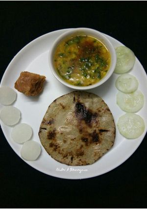 A picture of Bajra roti with mix dal.