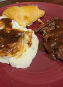 Beef roast with mashed potatoes and beef gravy