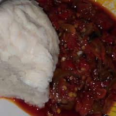 A picture of White moi moi with sauce.
