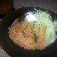 A picture of yummy chicken flautas.