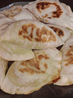 Una foto de 🥟Empanadas de humita calabaza y corazón de queso🤤 en la flip🌽