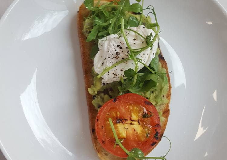 Recipe of Ultimate Soft Poached egg smashed avocado grilled tomato on sourdough