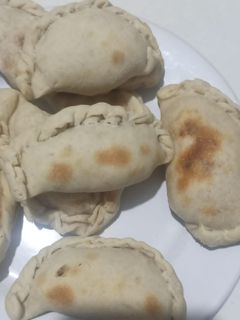 Una foto de Empanadas de merluza en lata