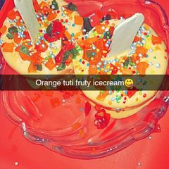 A picture of Orange tutti fruity ice cream.