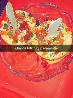 A picture of Orange tutti fruity ice cream.