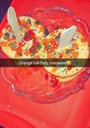 A picture of Orange tutti fruity ice cream.