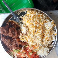 A picture of Biriyani with beef stew.