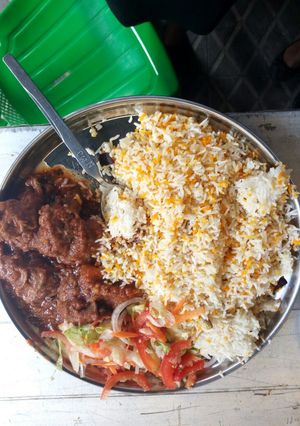 A picture of Biriyani with beef stew.