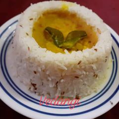 A picture of Jeera rice with Dal tadka.