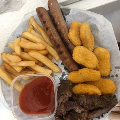 A picture of Suya, fries, hotdog and fish fillet.
