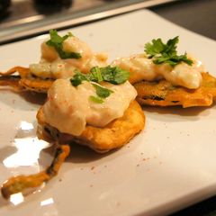 A picture of Spinach Fritters with topping.