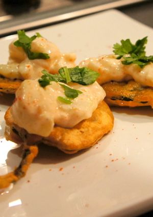 A picture of Spinach Fritters with topping.