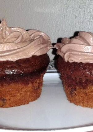 A picture of cookie brownie cupcakes w/chocolate marshmallow frosting.