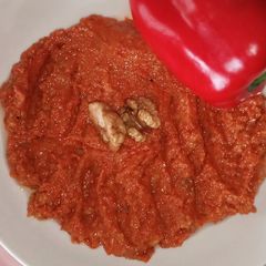 A picture of Roasted red pepper sauce "muhamara".