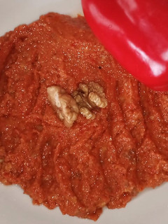 A picture of Roasted red pepper sauce "muhamara".