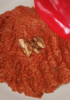 A picture of Roasted red pepper sauce "muhamara".