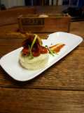 Sausages in tomato reduction w/ white potato mousseline and chip